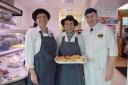 Shop staff and manager Brian Cockburn show off their shortlisted pies and other savory delights
