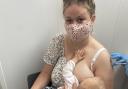 Wee County mum Tanisha breastfeeds her baby while receiving her Covid-19 vaccine