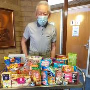 Tenant Mike Briggs, secretary of the registered tenants' organisation at the complex, with some of the donated items