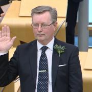 Alexander Stewart being sworn in as MSP at Holyrood for a second term