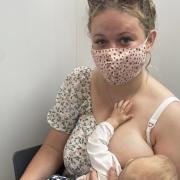 Wee County mum Tanisha breastfeeds her baby while receiving her Covid-19 vaccine