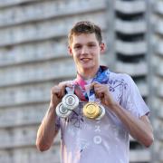 TOKYO, JAPAN - AUGUST 01: Duncan Scott of Great Britain poses with the the gold medal and three silver medal he won during the Tokyo 2020 Olympic Games at Tokyo Aquatics Centre on August 01, 2021 in Tokyo, Japan. (Photo by Ian MacNicol/Getty Images).