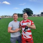 Fraser Donaldson of club sponsor F. Donaldson Bricklaying Services presenting the man of the match award to Scott McLennan
