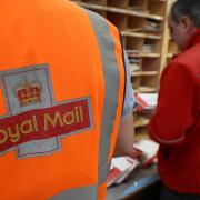 File photo dated 15/12/16 of Royal Mail workers at a sorting office. The result of a ballot for strikes by Royal Mail workers in a bitter dispute over pensions, pay and jobs will be announced on Tuesday. PRESS ASSOCIATION Photo. Issue date: Tuesday