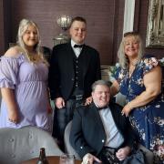 FUNDRAISER: Michael Dobbie (seated) suffered a stroke in 2021.