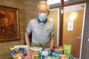 Tenant Mike Briggs, secretary of the registered tenants' organisation at the complex, with some of the donated items
