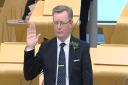 Alexander Stewart being sworn in as MSP at Holyrood for a second term