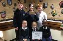 GOING FOR GOLD: Pupils at Deerpark Primary School celebrate achieving their silver award from the Scottish Book Trust. Picture provided by Deerpark PS.