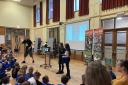 READING ROCKS: Author Stuart Reid entertains an assembly as he visited the school to promote reading. Picture provided by Clackmannanshire Council.