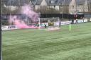 DAMAGE: The flares before the game caused damage to the pitch at the Indodrill.