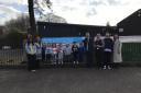 SILVER: Children and education chiefs at Sauchie ELC celebrated the award by unveiling a banner