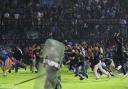Fans invade the pitch