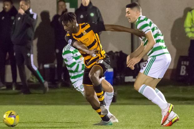 STANDING-UP: Alloa's Mouhamed Niang holds off the challenge of Celtic's Tom Rogic. Picture by John Howie