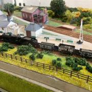 ATTENTION TO DETAIL: Modelling enthusiast Mick Rice spent months creating the miniature version of the former train station at Dollar