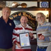 Forth Valley CAMRA volunteers Tony Lamb and Brian Cheeseman presented the award to the Gibson family at The Inn at Muckhart
