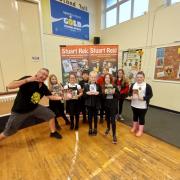 READING ROCKS: Stuart Reid with some pupils from Banchory