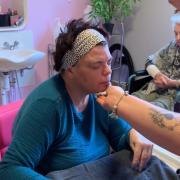 PAMPERED: One of the residents at Balhousie gets her nails done. Pictures provided by Balhousie.
