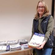 HAND DELIVERED: Jo McTaggart is one of countless volunteers who work to deliver the newsletter.