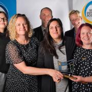 The Resilience Learning Partnership team with their award.