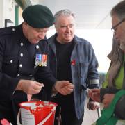 REMEMBRANCE: John Nicolson joined members of the Wee County Veterans in selling poppies.