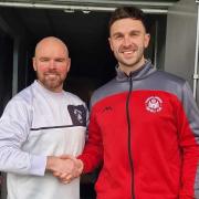 Assistant Manager Darren Cummings with Connor Millaghan.