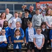 READING ROCKS: Tillicoultry PS received a gold accreditation from the Reading Schools programme, the young people and staff celebrating with children's author Stuart Reid