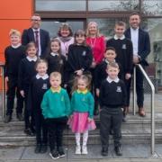 Councillor Graham Lindsay with staff and pupils from Alva PS.