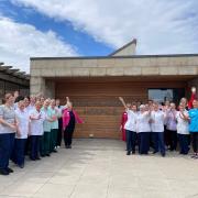 FIRST CLASS: Staff celebrate the report outside Strathcarron Hospice.