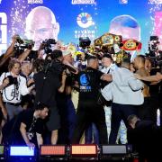 Tyson Fury and Oleksandr Usyk are pulled apart as tempers flare during the weigh-in (Nick Potts/PA)