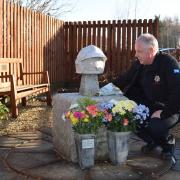 Alan with John's memorial, which sits behind Alloa Fire Station